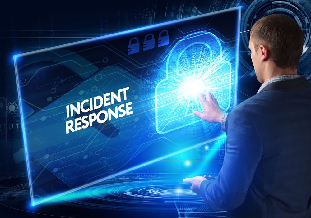 A businessman selecting "Incident Response" on a high tech screen.